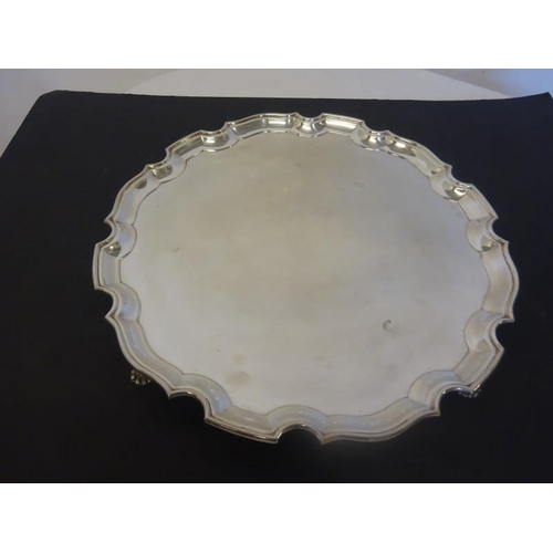 164 - William Egan - A large Cork silver salver with pie crust border and raised on shell feet. 1978, 77 t... 