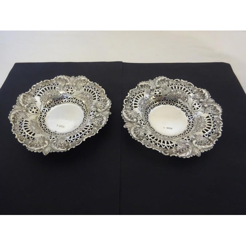 176 - A pair of decorative circular silver dishes, Sheffield 1893, 8 troy ozs.