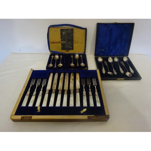 183 - Six mother of pearl handle and plated fruit knives and forks together with a cased set of six decora... 