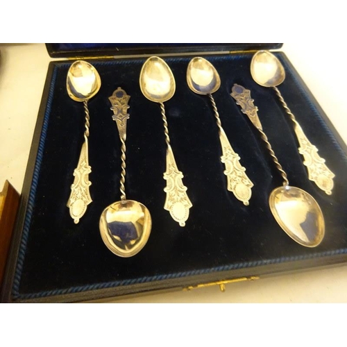 183 - Six mother of pearl handle and plated fruit knives and forks together with a cased set of six decora... 