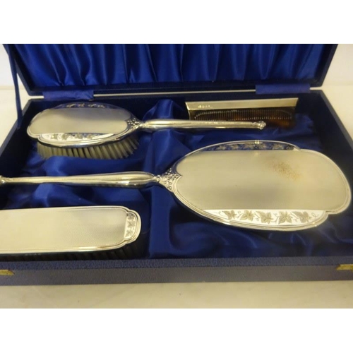 185 - Cased silver brush, comb and mirror set, Birmingham 1902.