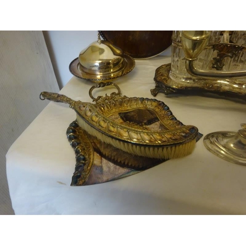 187 - A mixed lot of plated ware to include a decanter set, candleabra, table brush and crumb tray, etc.