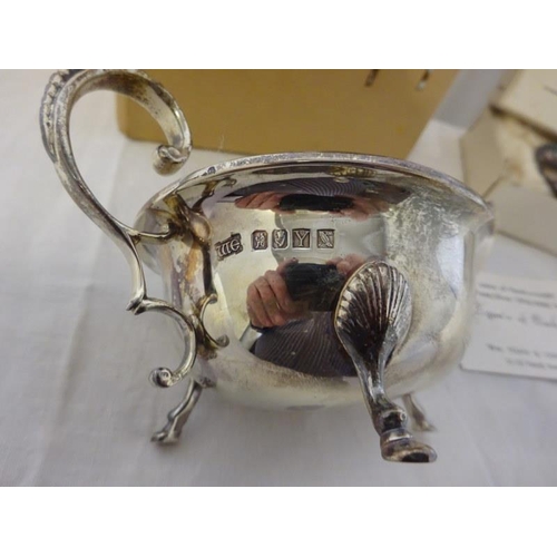 195 - A Jubilee silver sauce boat by William Egan, Cork 1966 together with a small silver dish by James Ma... 