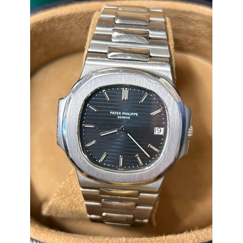 205 - A Patek Philippe Nautilus stainless steel automatic gents wrist watch with black-blue dial, luminesc... 