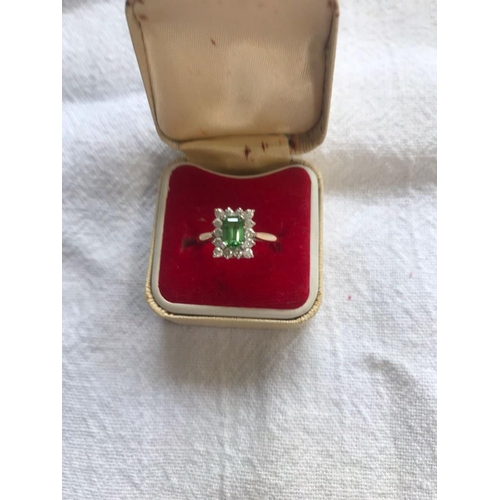 213 - 18 carat gold emerald and diamond ring. Size K/L.