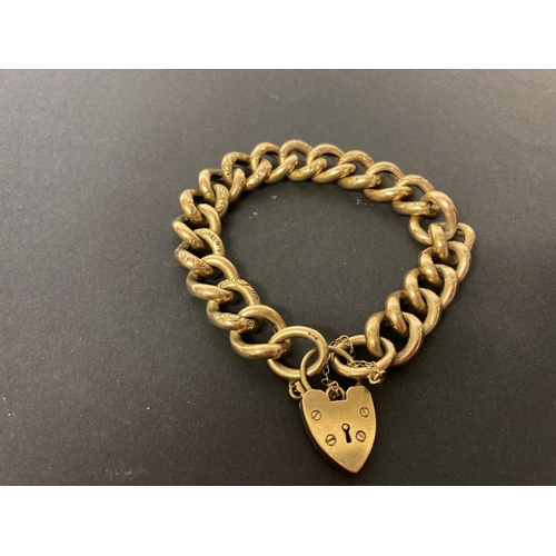 220 - 9 carat gold curb link bracelet with heart shaped lock with 31.1 grams.