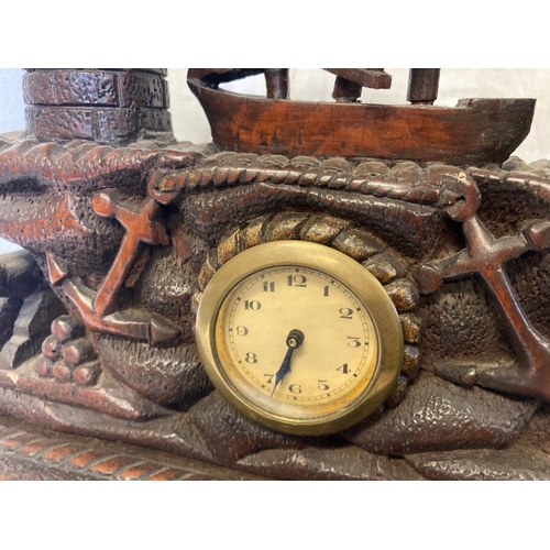 223 - Cork School of Carving - An interesting late 19th century oak mantle clock, the top section carved w... 