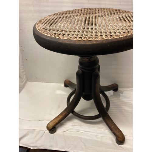 224 - Thonet - A 19th century bentwood stool adjustable with makers label.