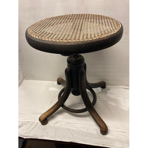 224 - Thonet - A 19th century bentwood stool adjustable with makers label.