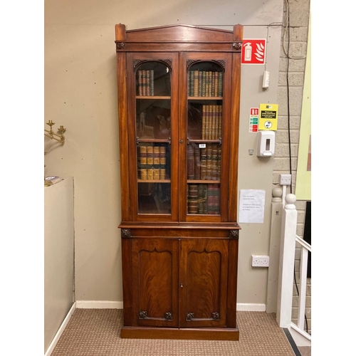 229 - A neat size 19th century mahogany bookcase, the upper section having two mahogany and glass doors, t... 