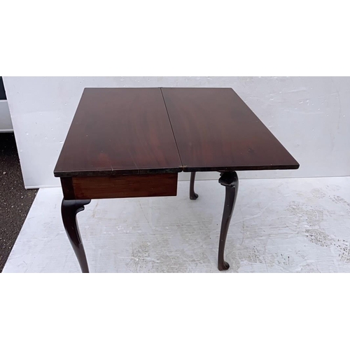 234 - Irish Georgian mahogany fold over tea or side table raised on shaped legs with pad feet.