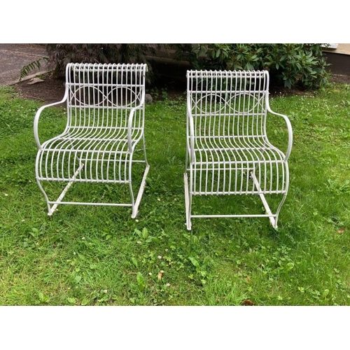 241 - A good pair of antique wire work roll back garden chairs.