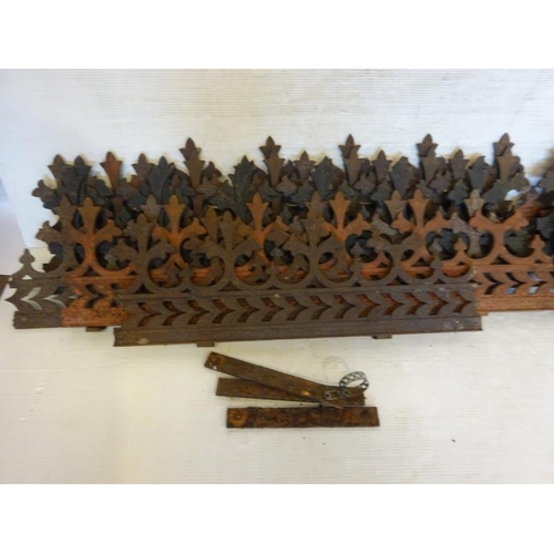 243 - A large quantity of old cast iron wall top decoration.