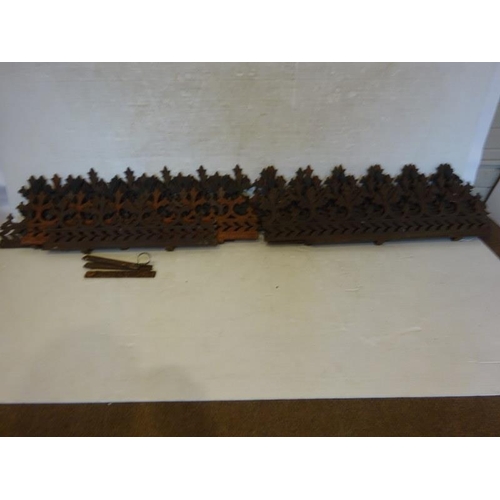 243 - A large quantity of old cast iron wall top decoration.