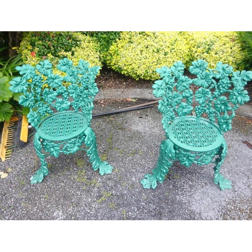 250 - A pair of good cast iron garden chairs from a design by Charles D. Young, Edinburgh together with a ... 