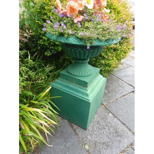 263 - Cast iron garden urn on large pedestal, piece of rim missing. H. 90cm approx.