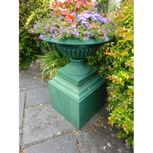 263 - Cast iron garden urn on large pedestal, piece of rim missing. H. 90cm approx.