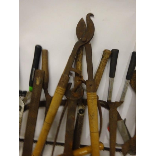 266 - A quantity of garden tools - clippers, etc.