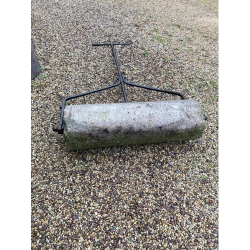 275 - Old stone garden roller with metal handle.