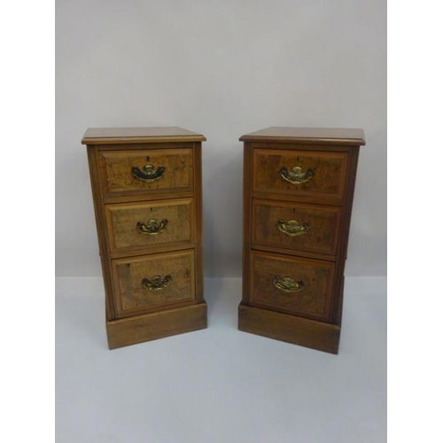 294 - Pair of antique walnut three drawer bedside chests fitted with brass handles on plinth bases. H. 80c... 