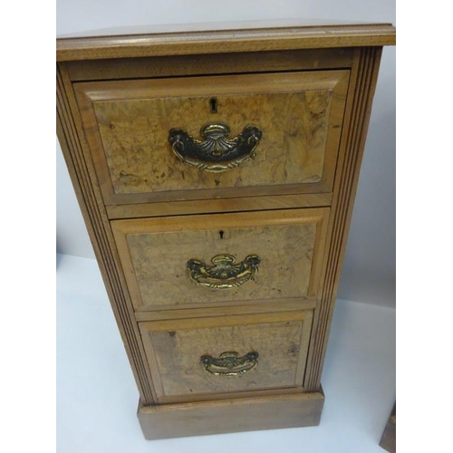 294 - Pair of antique walnut three drawer bedside chests fitted with brass handles on plinth bases. H. 80c... 