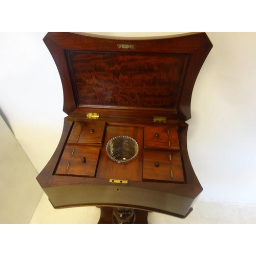 296 - A good 19th century mahogany tea poy, the shaped top with carved decoration opening to reveal a fitt... 