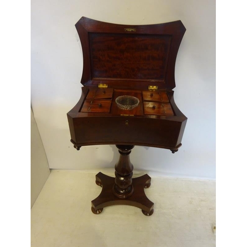 296 - A good 19th century mahogany tea poy, the shaped top with carved decoration opening to reveal a fitt... 