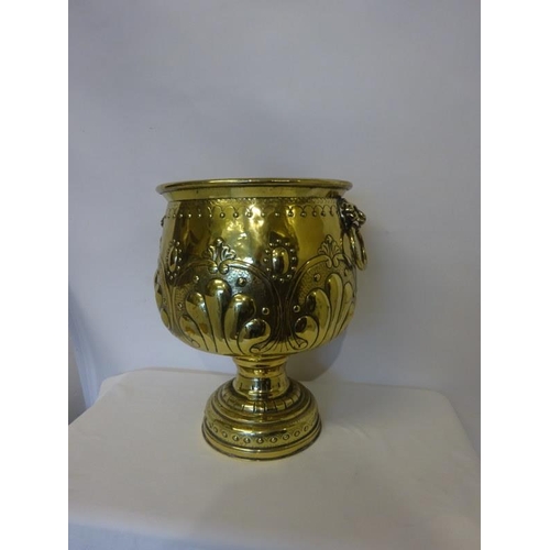 303 - A good Victorian brass jardinere on pedestal base having lion mask ring handles.. H. 47cm approx.