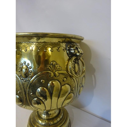 303 - A good Victorian brass jardinere on pedestal base having lion mask ring handles.. H. 47cm approx.