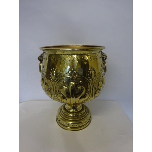 303 - A good Victorian brass jardinere on pedestal base having lion mask ring handles.. H. 47cm approx.