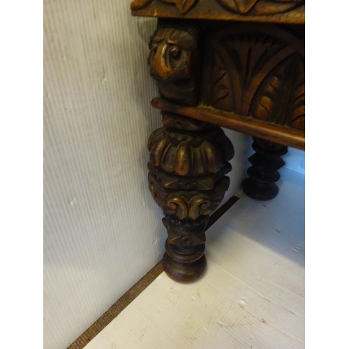 306 - An antique carved walnut hall bench, the back with a central heraldic sheild carved Nun Quam Non Par... 