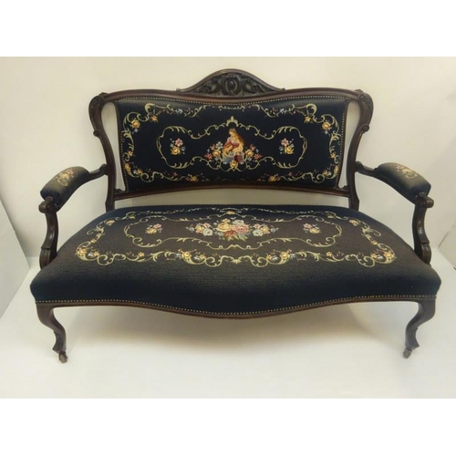 307 - Late 19th century mahogany framed settee with needlework upholstery.