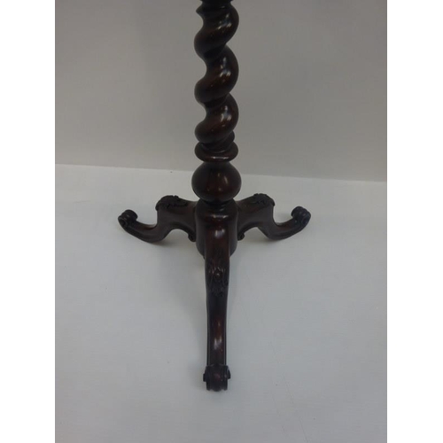 315 - Victorian carved mahogany pole screen having needlework panel and raised on tripod base.