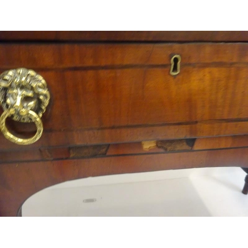 317 - Regency mahogany sideboard, the reeded top over cupboards and drawer with lion mask handles and rais... 