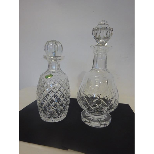 32 - Two Waterford cut glass decanters and stoppers.