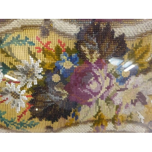 43 - Victorian needlework housed in an attractive walnut frame. 57cm x 30cm approx.