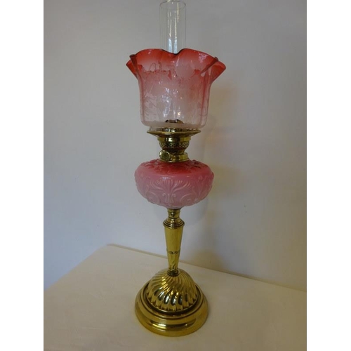 49 - Victorian oil lamp with red glass shade.