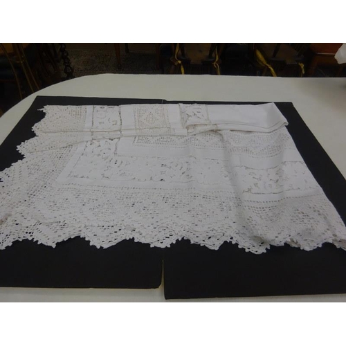 5 - A box of assorted linen to include a large crochet table cloth.  250cm x 165cm approx.