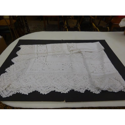 5 - A box of assorted linen to include a large crochet table cloth.  250cm x 165cm approx.