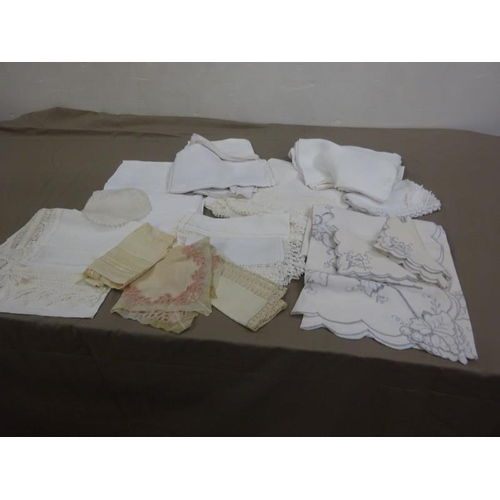 5 - A box of assorted linen to include a large crochet table cloth.  250cm x 165cm approx.