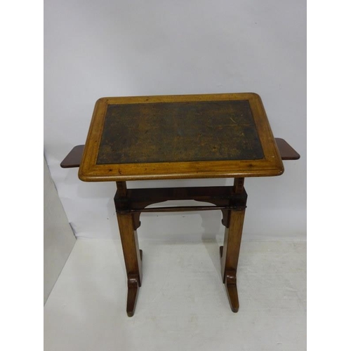 65 - A 19th century oak drawing or writing table, adjustable.