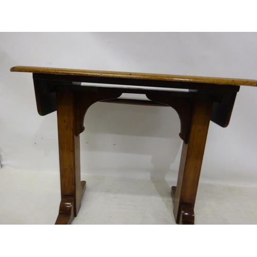 65 - A 19th century oak drawing or writing table, adjustable.