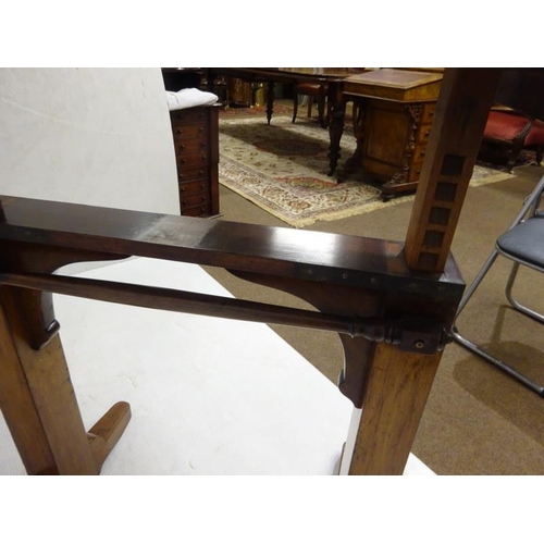 65 - A 19th century oak drawing or writing table, adjustable.