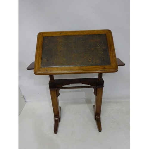 65 - A 19th century oak drawing or writing table, adjustable.