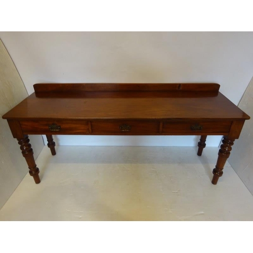 70 - A large Victorian mahogany side table, the rectangular top fitted with three drawers and raised on t... 