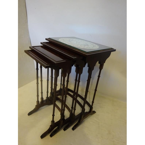 74 - A mahogany nest of four tables.