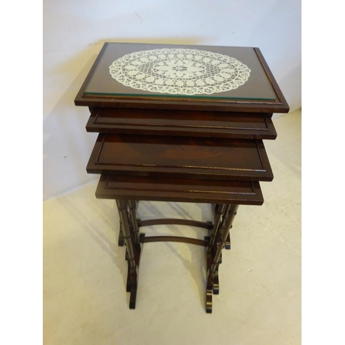 74 - A mahogany nest of four tables.