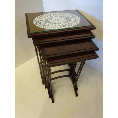 74 - A mahogany nest of four tables.