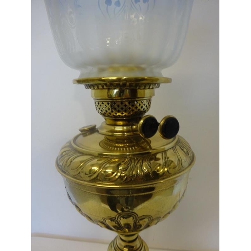 76 - Brass and blue glass oil lamp and shade.