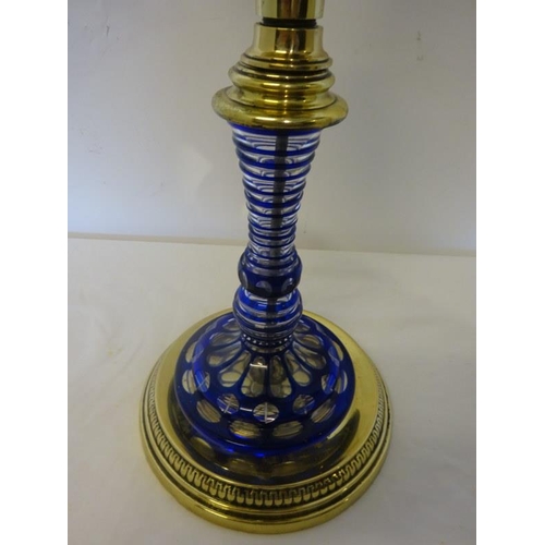 76 - Brass and blue glass oil lamp and shade.